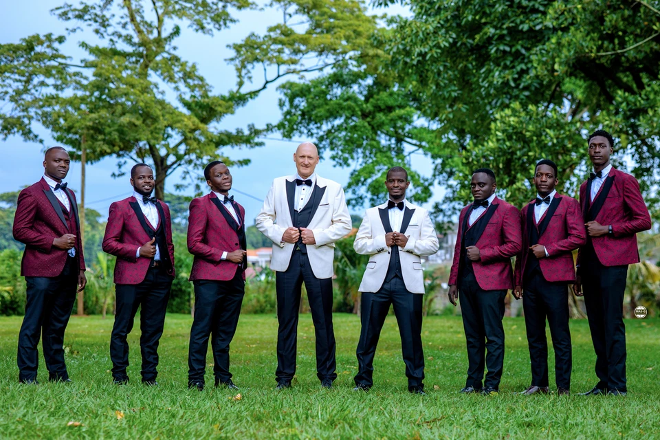 Groom and wedding party in a garden
